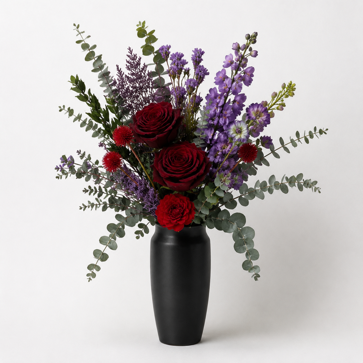 asymmetrical garden-style arrangement in a dark romantic palette style floral arrangement with Preserved Rose, Red Multi