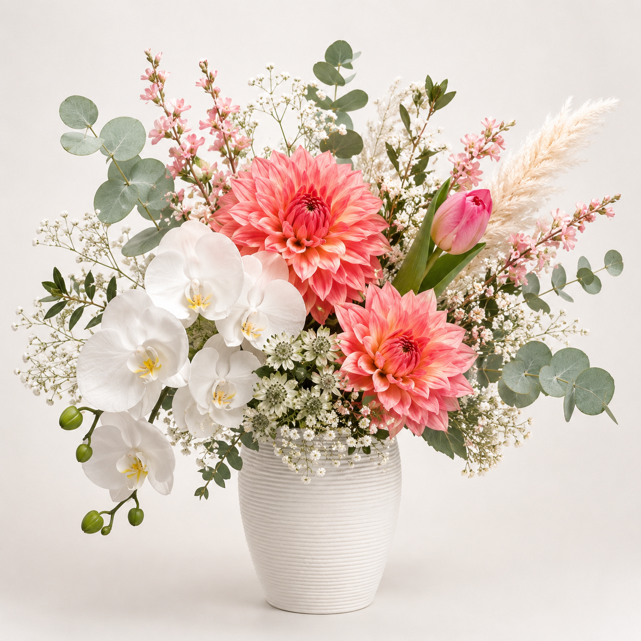 romantic garden-style pastel arrangement style floral arrangement with Dahlia, Pink Tulip, Silver Dollar Eucalyptus, Fin